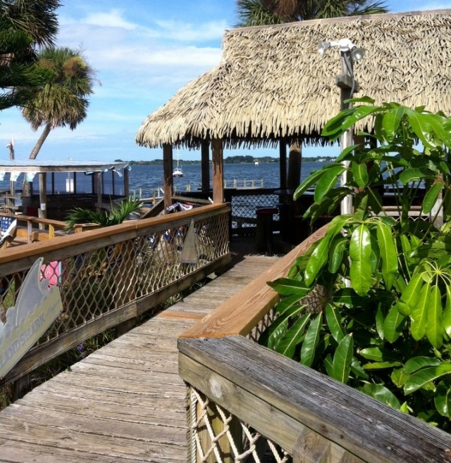 Tropical outdoor wedding reception setup at Pineda Inn Bar & Grill.